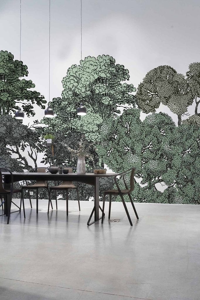 The wallpaper in the modern dining room features a large mural with detailed illustrations of green trees. The mural showcases various shades of green, capturing the lushness and vibrancy of a verdant forest. The intricate tree designs emphasize texture and depth, creating an immersive natural backdrop.