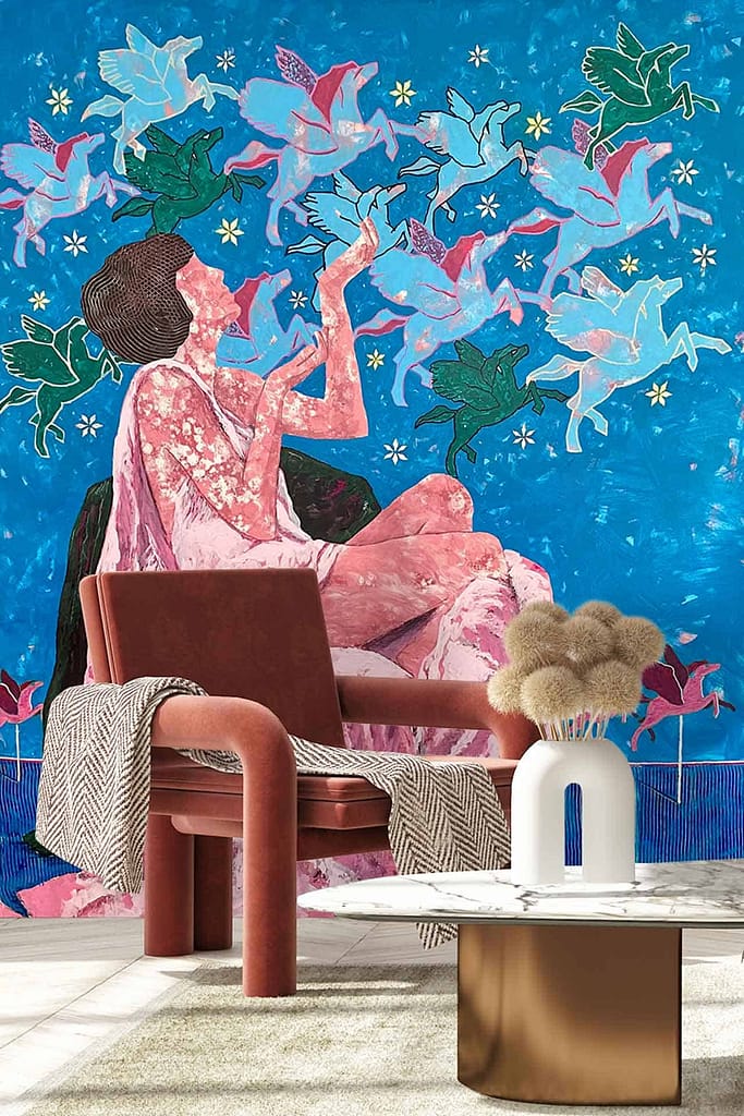 An abstract wall mural features a figure surrounded by whimsical flowers and birds on a vibrant blue background. The elements include figures, flowers, and birds with dominant colors of blue, rust, and various bright hues.