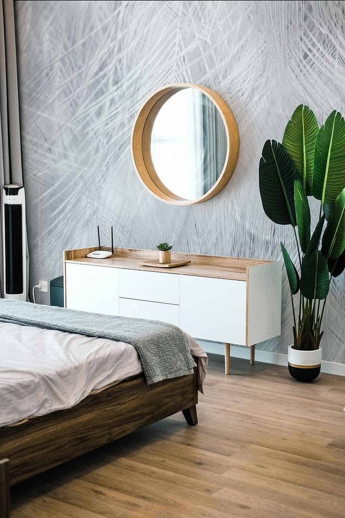 The wallpaper features a subtle texture with shades of gray and white, providing a soft, modern backdrop.