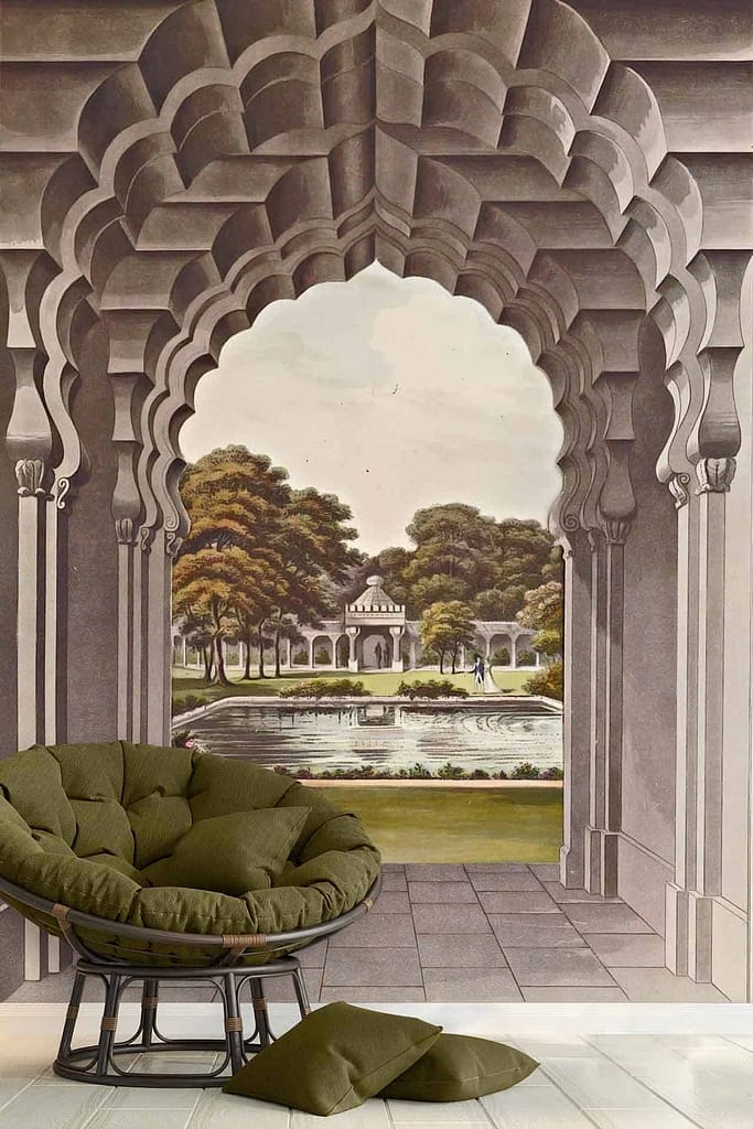 The wallpaper mural features an arched pathway leading to a serene garden. The pathway is flanked by lush greenery and vibrant flowers. In the distance, there's a classical pavilion and a tranquil fountain surrounded by trees. Elements include arches, pathways, fountains, gardens, trees, pavilions. Colors to note are green for foliage, various floral hues like pink and yellow, earthy tones for the pathway, blue for water in the fountain, and subtle pastels on the pavilion.