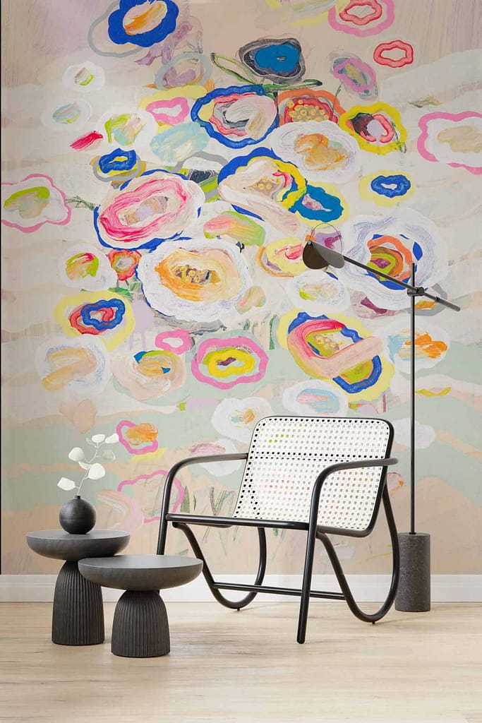 The pastel-colored wall mural features abstract floral designs incorporating soft hues such as blush pink, mint green, lavender, and subtle gold accents. The flowing patterns and stylized botanical forms create a delicate and modern aesthetic ideal for enhancing a living area with artistic charm.
