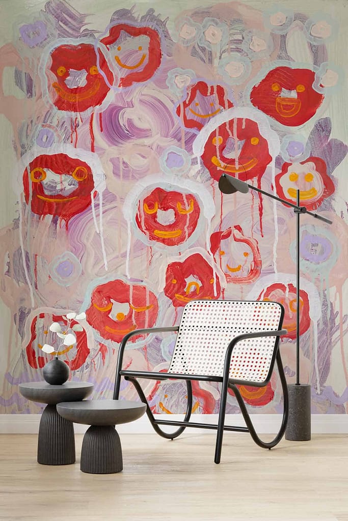 Colorful wall mural with abstract red and pink flowers, artistic and vibrant feel.