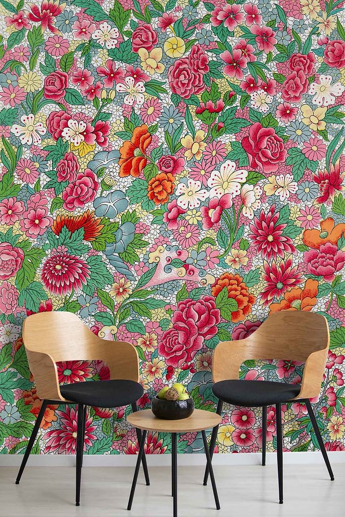 The wallpaper is vibrant with floral patterns featuring an array of colorful flowers including roses and peonies. Dominant colors are shades of red, pink, yellow, green leaves, and occasional blue accents. The intricate design evokes a historical charm reminiscent of Outlander.