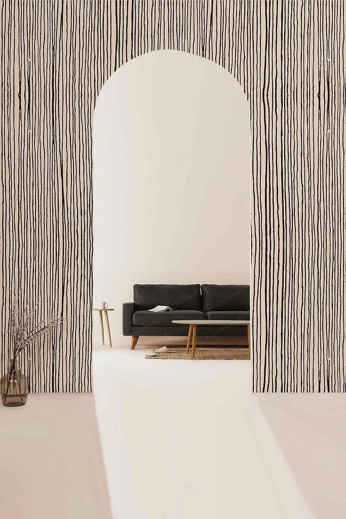 The wallpaper features black vertical stripes on a light background, creating a bold yet minimalist statement. The contrast of the dark lines against the pale hue adds depth and artistic flair to the room's design.