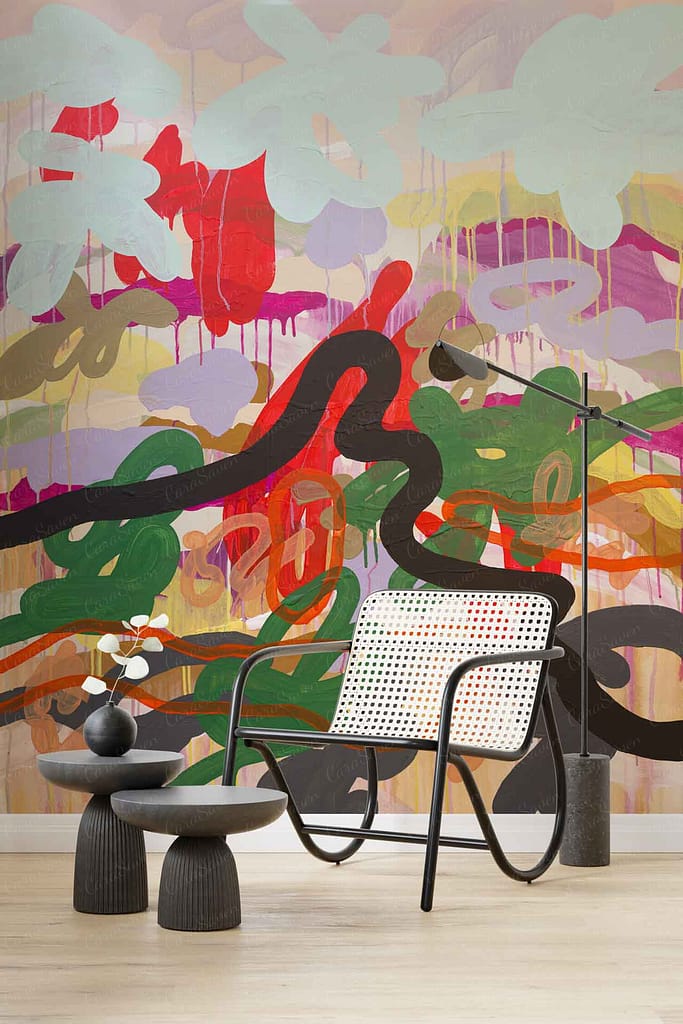 Abstract mural with colorful, swirling brushstrokes, evokes fluidity of dance; bold splashes of red, blue, yellow, and green intertwine over a white base.