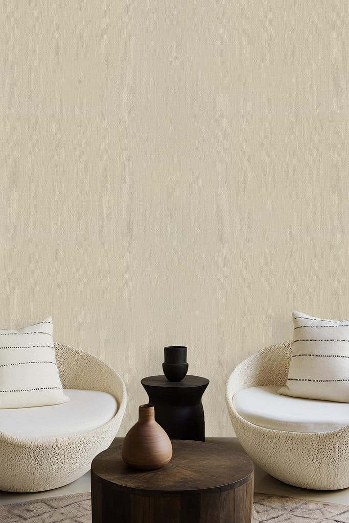 The wallpaper is plain beige, featuring a neutral, solid color.