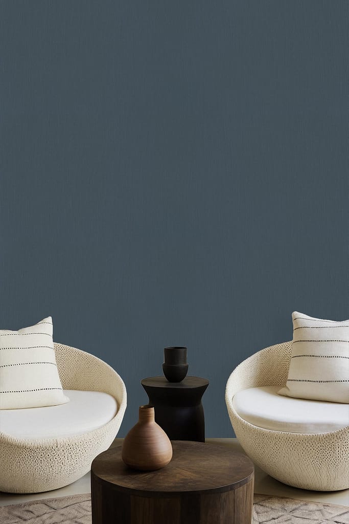 Muted teal wall, solid color.