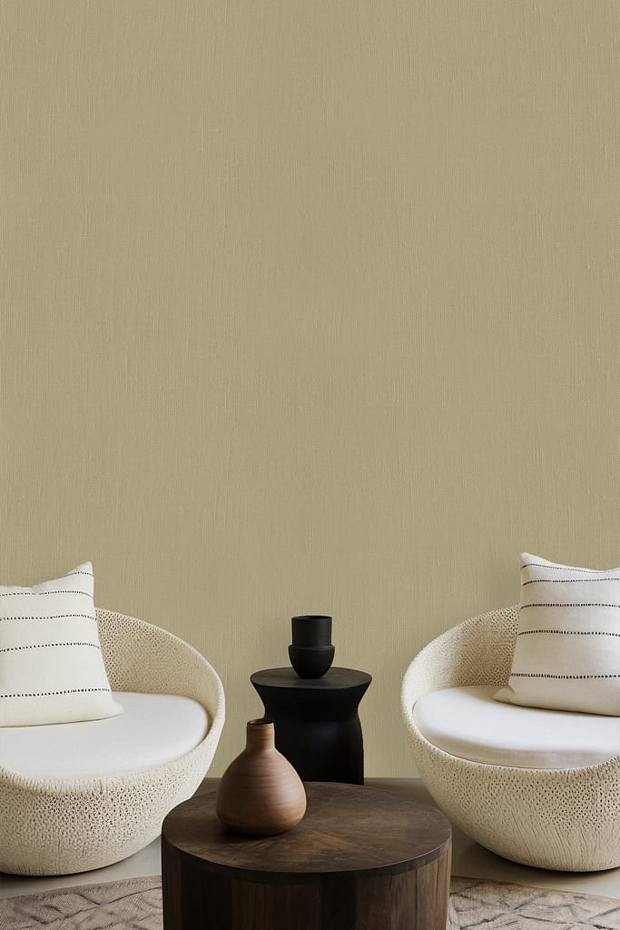The wallpaper in the minimalist living room features a beige color that perfectly captures the essence of Wild Wonder. The design includes subtle patterns in soft earth tones, complementing the decor and adding a touch of natural elegance to the space. Look for elements like gentle swirls and leaf motifs in muted shades.
