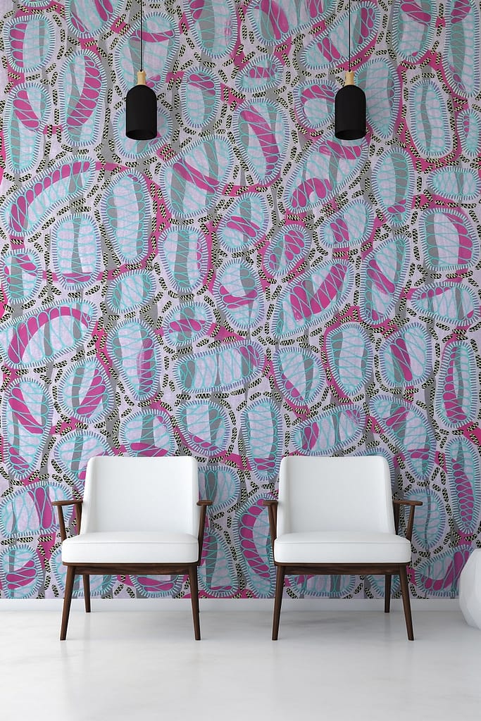 Brightly patterned wallpaper featuring swirling blue, pink, and white designs with dotted black accents.