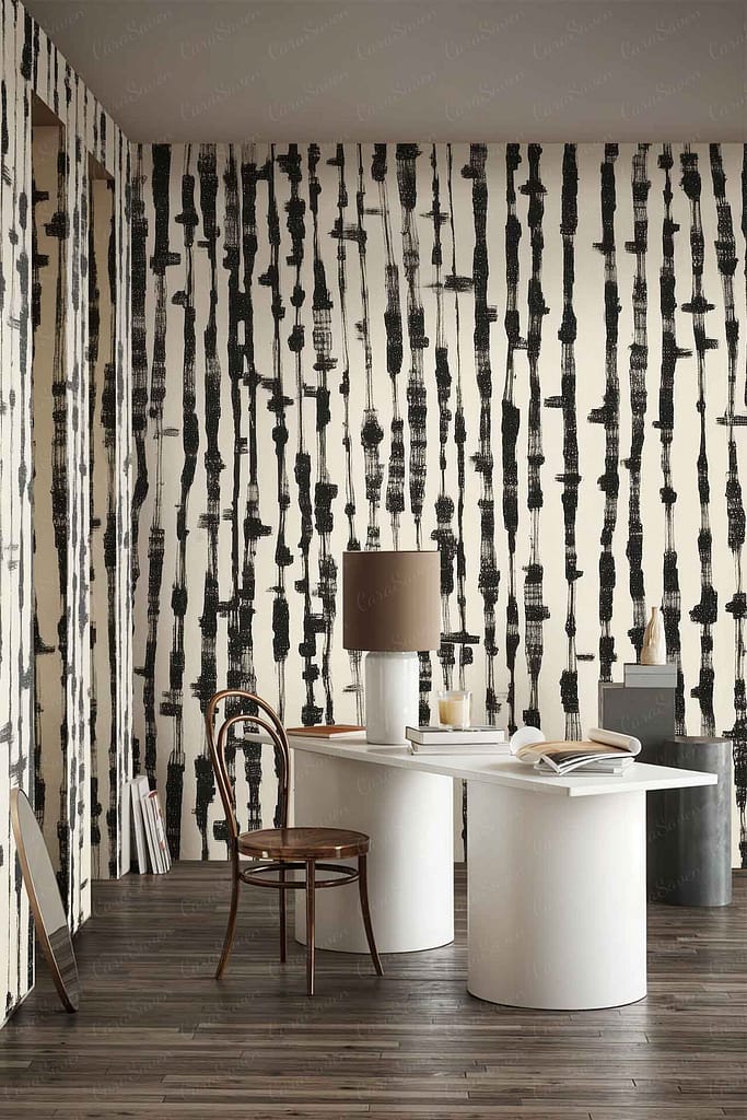 Abstract black and white patterned wallpaper featuring bold geometric shapes and high-contrast lines; graphic elements in monochrome make the wall a striking focal point.