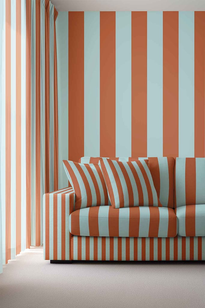 Wallpaper with bold vertical stripes in alternating light blue and burnt orange decorates the wall in a modern living room.