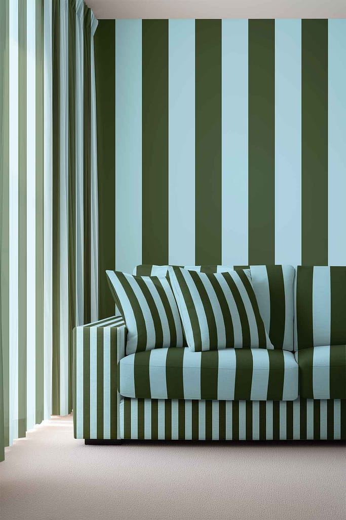 Wallpaper with alternating vertical green and blue stripes creates a bold, coordinated look, matching the colors and patterns found elsewhere in the room.