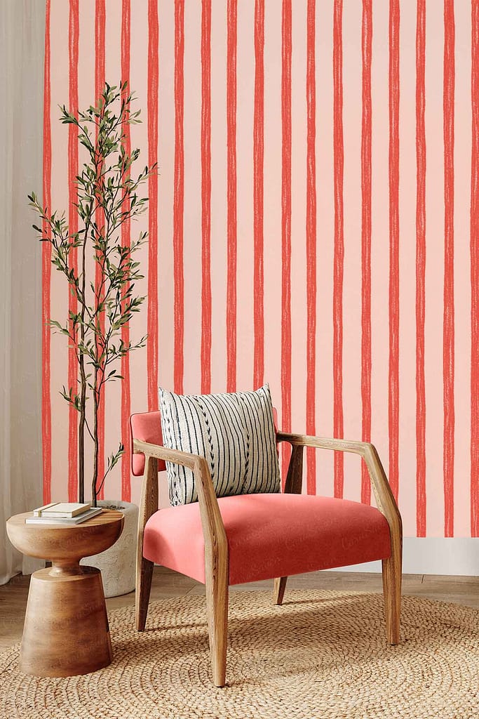 Wallpaper with bold vertical red stripes on a pale pink background, creating a striking and modern look.