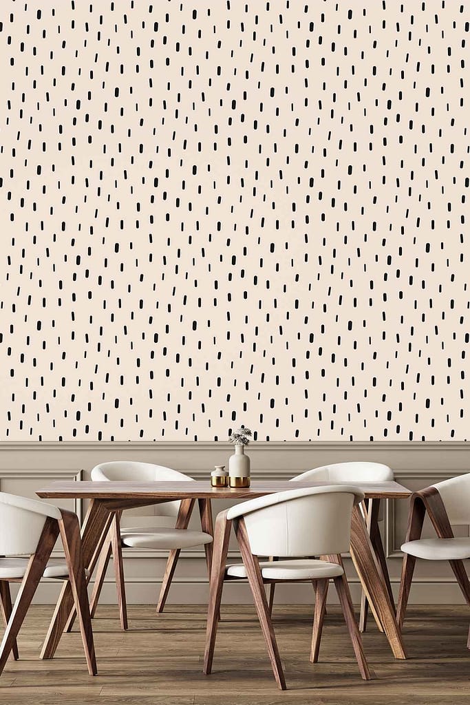 Beige wallpaper with a black dotted abstract pattern.
