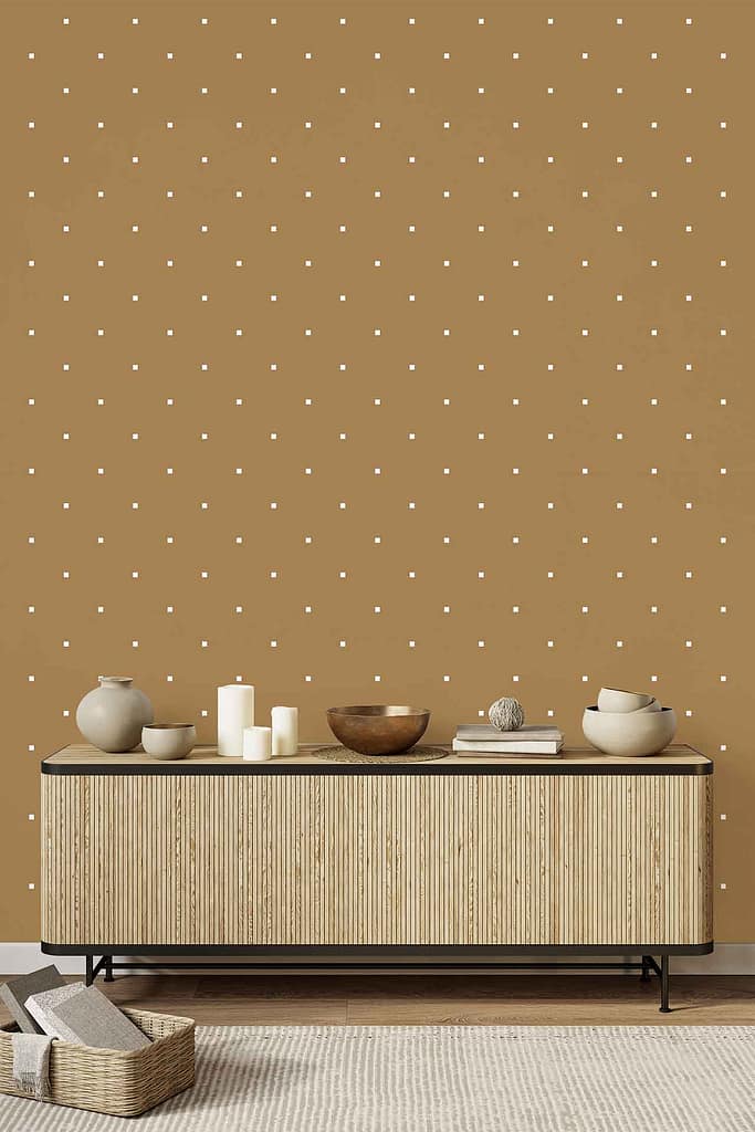 Tan wall with a playful white polka dot wallpaper pattern, featuring evenly spaced white dots across a warm beige background.