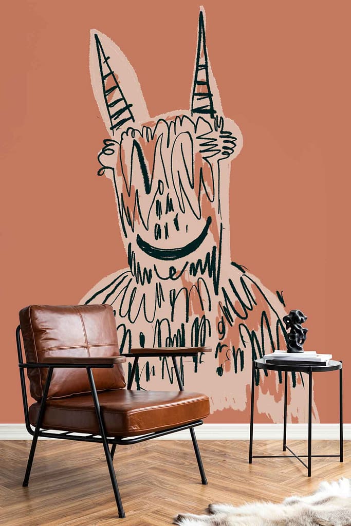 A large mural wallpaper featuring an abstract creature with horns and a wide smile, surrounded by balloon animals, all set against a terracotta background with playful, whimsical elements and warm earthy tones.