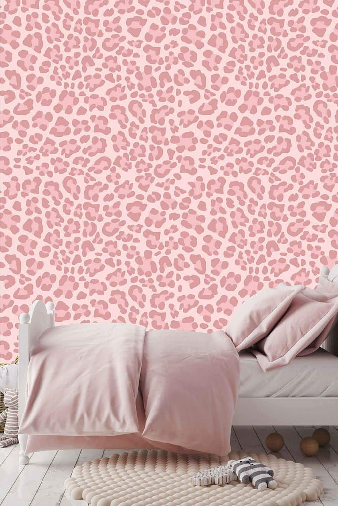 Pink and mauve leopard print wallpaper with the phrase "Change Your Spots" encourages creativity and change. The vibrant pattern combines soft pink and rich mauve tones, adding a dynamic and stylish touch to the bedroom.