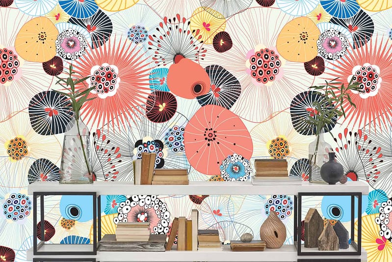 Vibrant, abstract wallpaper with circular, floral-inspired patterns. Bright colors: blue, yellow, red, and black. Dynamic and lively background.