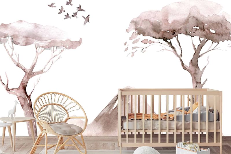 The wallpaper showcases watercolor-style tree paintings in soft pinks and browns, complemented by birds flying. The serene, nature-themed decor creates a peaceful ambiance for a nursery.