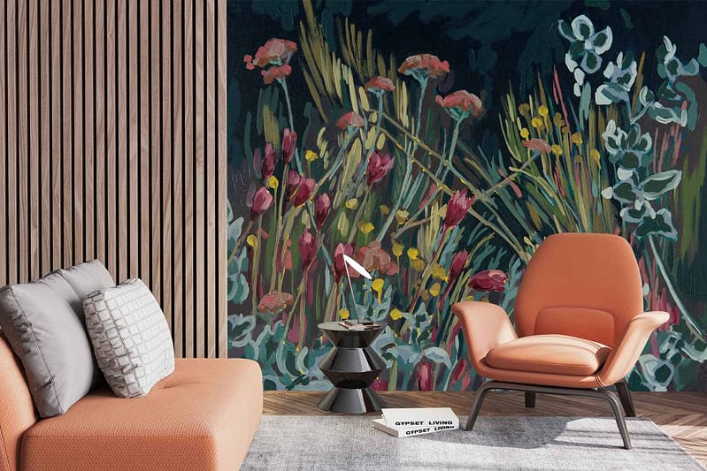The wallpaper showcases a vibrant floral mural inspired by Fynbos and Pink Everlastings. It features an array of colorful blossoms in shades of pink, green foliage, and intricate botanical designs.