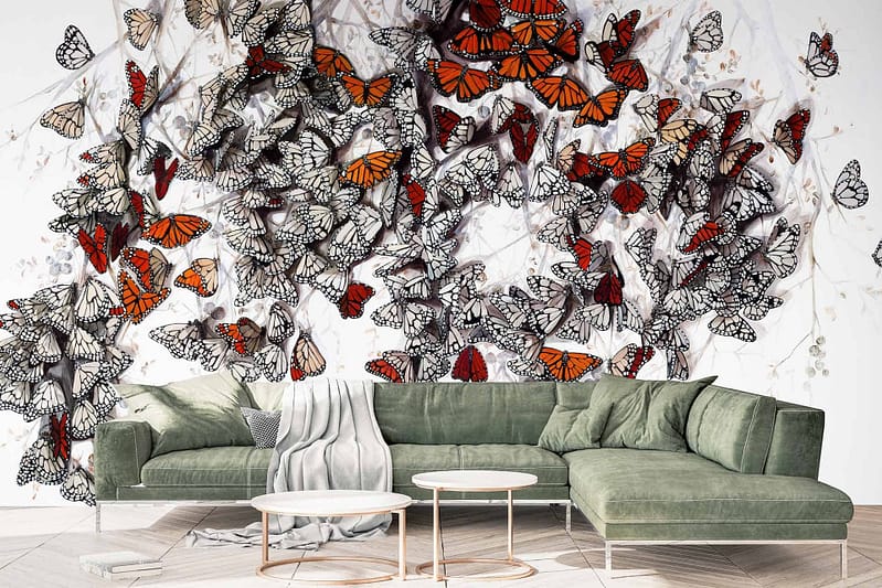 Vibrant butterflies in shades of orange and black, with a few in white and black.
