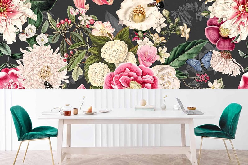 The wallpaper showcases a large, vibrant floral mural featuring various flowers, leaves, and butterflies on a dark background. The colors include bright pinks, yellows, blues, greens, and pops of white against deep hues for dramatic contrast.