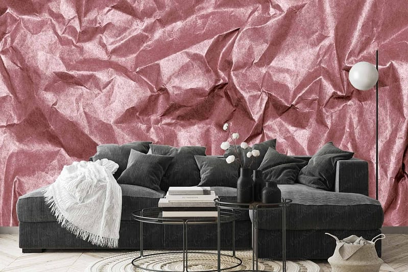 Textured pink wall resembling crumpled paper; shades of pink gradient; crinkled and wrinkled patterns; soft blush tones with deeper rose highlights.