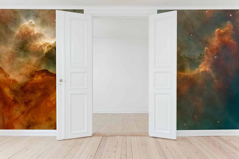 Celestial-themed murals with nebulas in orange, brown, and green hues.