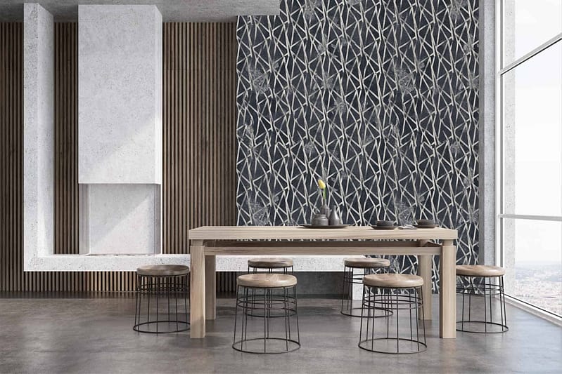 The wallpaper features a geometric, lattice-like design in neutral tones. It includes intersecting lines and shapes, creating an intricate pattern with shades of beige, gray, and subtle hints of metallic silver.