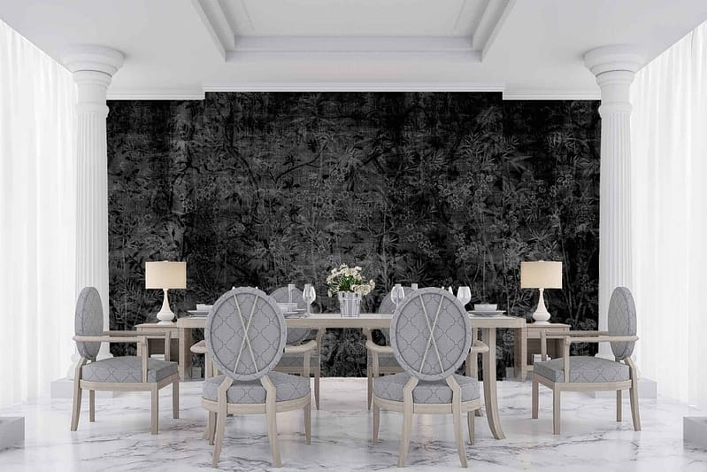 The wallpaper features a black background with botanical-themed elements, including vivid green leaves and detailed floral patterns in shades of white and grey.