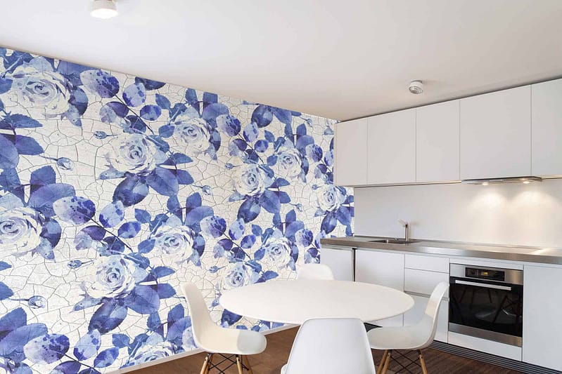 Bold accent wall, mosaic pattern, large blue and white Delft roses, vibrant artistic look.