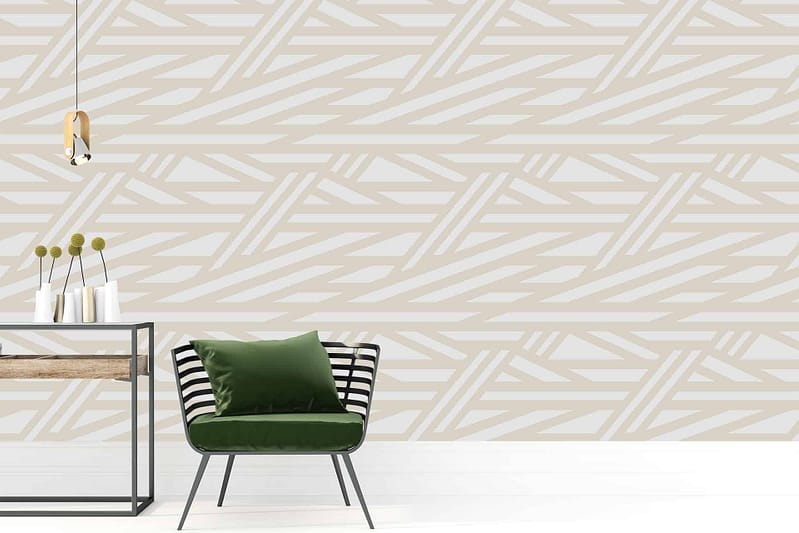 A modern interior features a wall with a geometric beige and white pattern. The wallpaper includes elements such as beige shapes combined with white lines, creating a stylish, contemporary design.