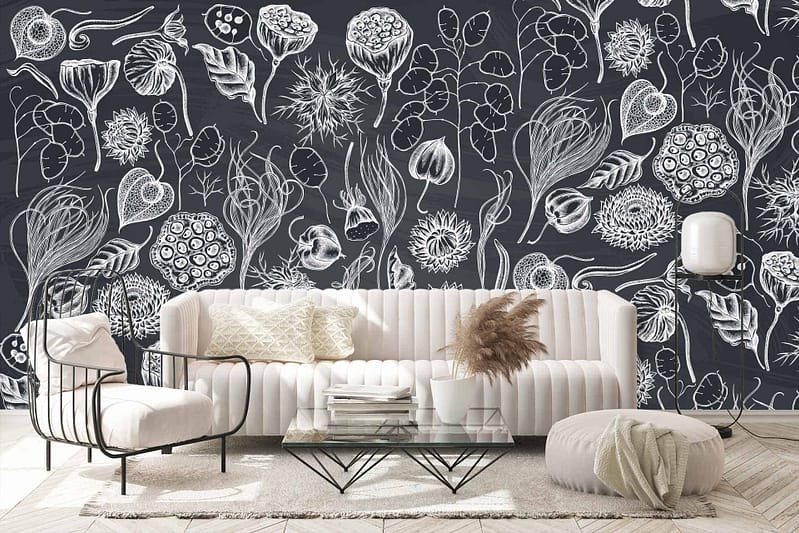 The wallpaper in the stylish living room features an artistic black and white botanical mural with intricate floral designs. It includes detailed depictions of flowers, leaves, and vines, all rendered in high-contrast black ink on a white background. This monochromatic theme with elegant floral patterns creates a serene atmosphere in the space. Keywords: black and white botanical mural, intricate floral designs, detailed flowers and leaves, monochromatic wallpaper.