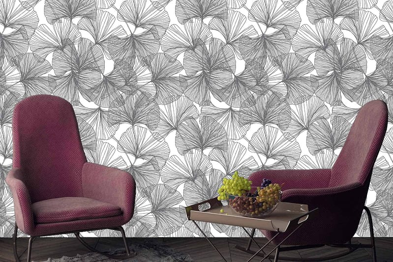 The wallpaper features a floral pattern with delicate ginkgo leaves. It showcases colors such as soft greens, yellows, and off-whites. The design is intricate, highlighting the natural elegance of ginkgo leaves.