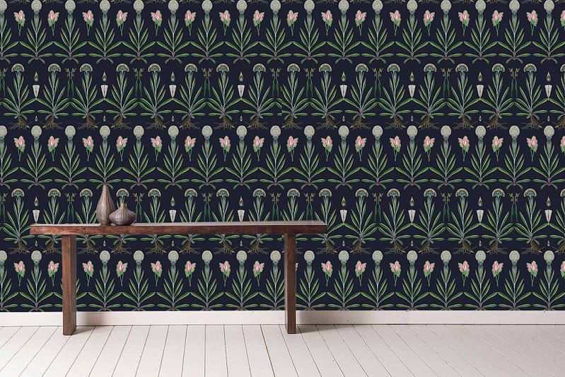 The wallpaper features a repeating botanical pattern with green leaves and pink flowers set against a dark-colored background.