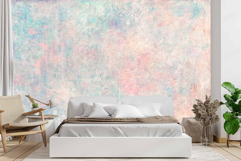 Pastel-colored abstract wall mural features soft hues of pink, blue, green, and yellow. Swirling patterns and delicate brush strokes create a whimsical backdrop. The design blends seamlessly with the room's serene color palette while adding a touch of artistic flair.