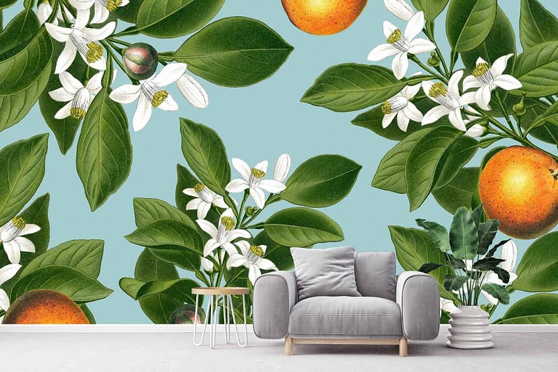 Vibrant wallpaper with orange fruits, white flowers, and lush green leaves on a light blue background. Themes: orange blossoms, floral elements, botanical design. Colors: orange, white, green, light blue.