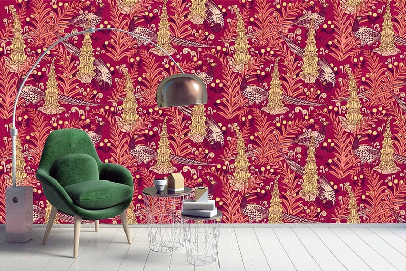 A stylish room features a vibrant, intricate red and gold patterned wallpaper adorned with playful pheasant motifs.