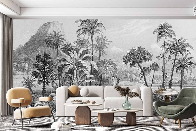 A modern living room features a large black-and-white tropical mural on the wall, depicting palm trees and mountainous landscapes.