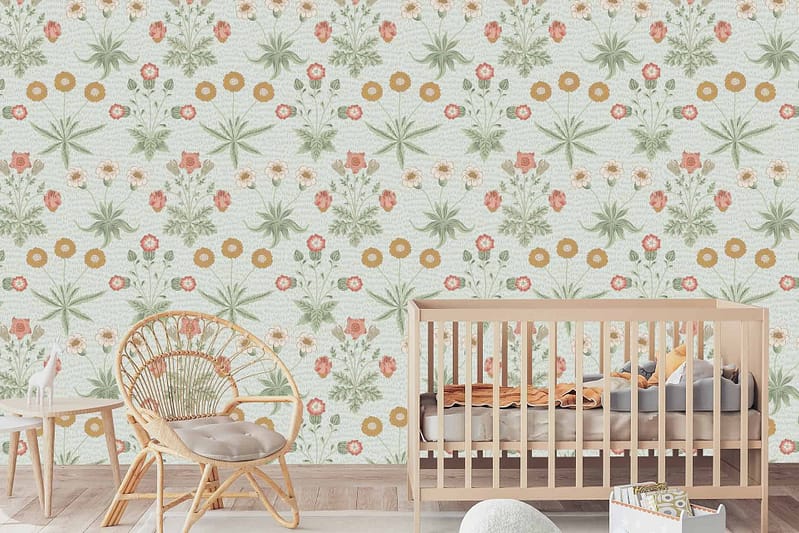 Sarah's nursery wallpaper features green and orange flowers, showcasing a floral theme.