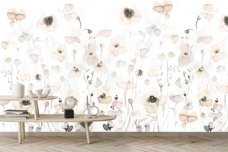 A light, airy room features a watercolor floral mural with delicate, pastel-colored flowers on a white background. The wallpaper includes soft hues such as blush pinks, lavender purples, and pale blues. Floral elements are intricately painted in a watercolor style.