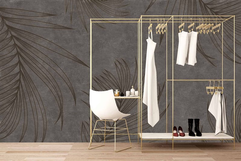 The stylish dark wallpaper features large, elegant leaf patterns in subtle shades of gray and charcoal, creating a sophisticated backdrop. The leaves have intricate details with varying tones, adding depth and texture to the minimalist space.