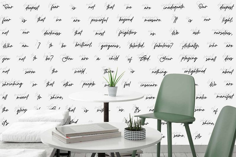 The wallpaper is a white backdrop featuring black cursive inspirational quotes.