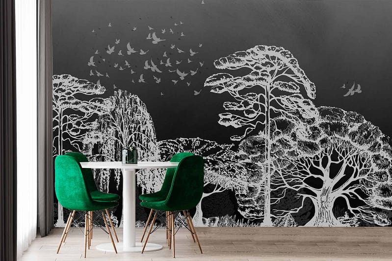 The wallpaper features a large silhouette mural of trees and flying birds. The colors include natural hues with shades of black and grey for the silhouettes against a soft, muted background. Serene and artistic ambiance.
