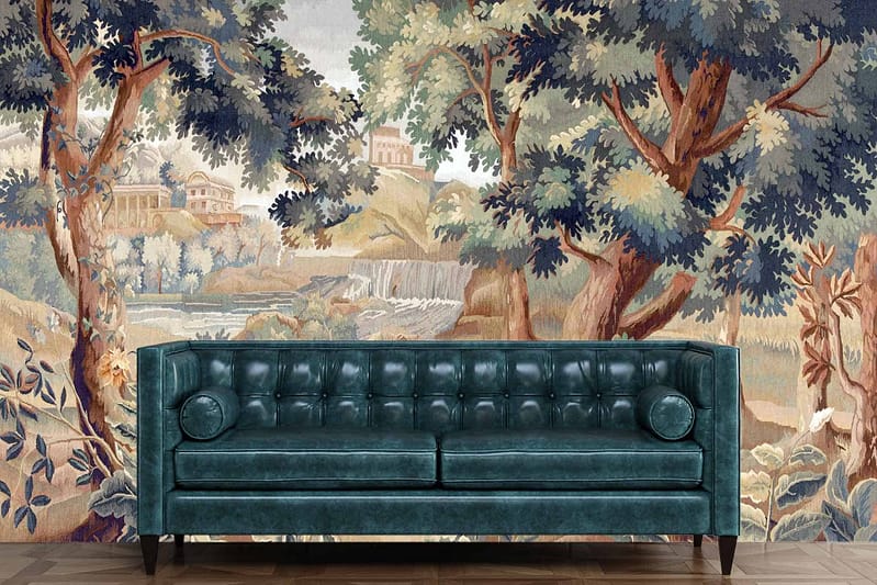 A mural with a scenic landscape featuring trees, a river, and distant buildings in watercolor style. The colors include green foliage, blue water, and muted tones for the buildings. The design looks like an intricate tapestry adding an artistic and vintage ambiance.