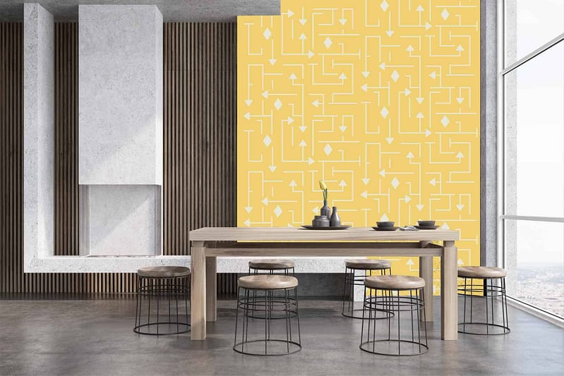 The back wall showcases a vibrant yellow geometric wallpaper pattern, featuring bold lines and shapes. The striking design pairs warm yellow hues with sharp geometric elements, making it a focal point in the modern dining space.