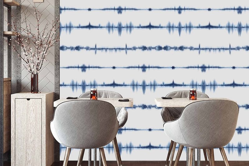 The wallpaper features a blue and white tie-dye pattern resembling sound waves. The blue hues vary from deep navy to lighter shades, creating a dynamic wave-like effect against the white background.