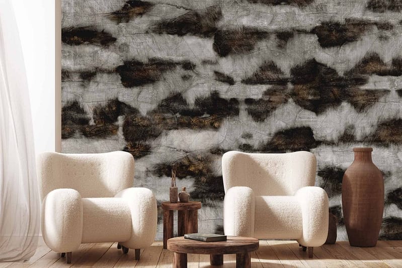 The wallpaper is textured and features an abstract black and white design. The elements include bold, irregular shapes and patterns, creating a dynamic visual effect. The contrast between the black and white tones adds depth and interest to the space.