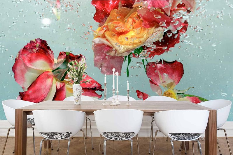 The dining room features a large wall mural of various flowers, including delicate roses, submerged in aqua-toned water with bubbles. The wallpaper is vibrant and dynamic with floral elements and shades of aqua.