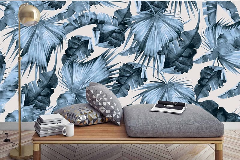 Bold wallpaper featuring large, abstract palm leaves in blue and green.